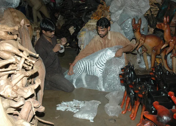 Finishing & Quality Inspection stage of handcrafting a leather animal sculpture